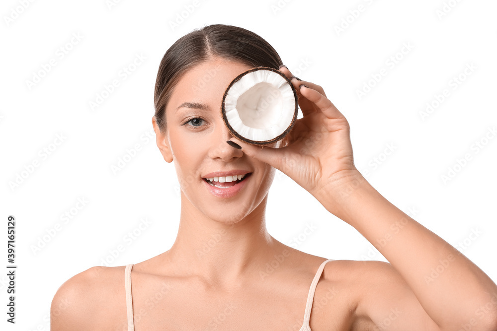 Beautiful young woman with coconut on white background