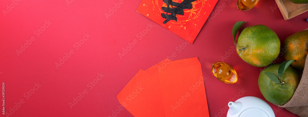 Top view of fresh tangerine mandarin orange on red background for Chinese lunar new year.