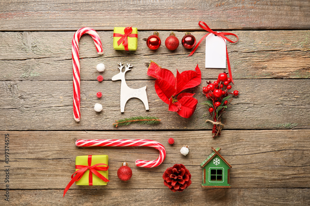 Composition with flowers of Christmas plant poinsettia on wooden background