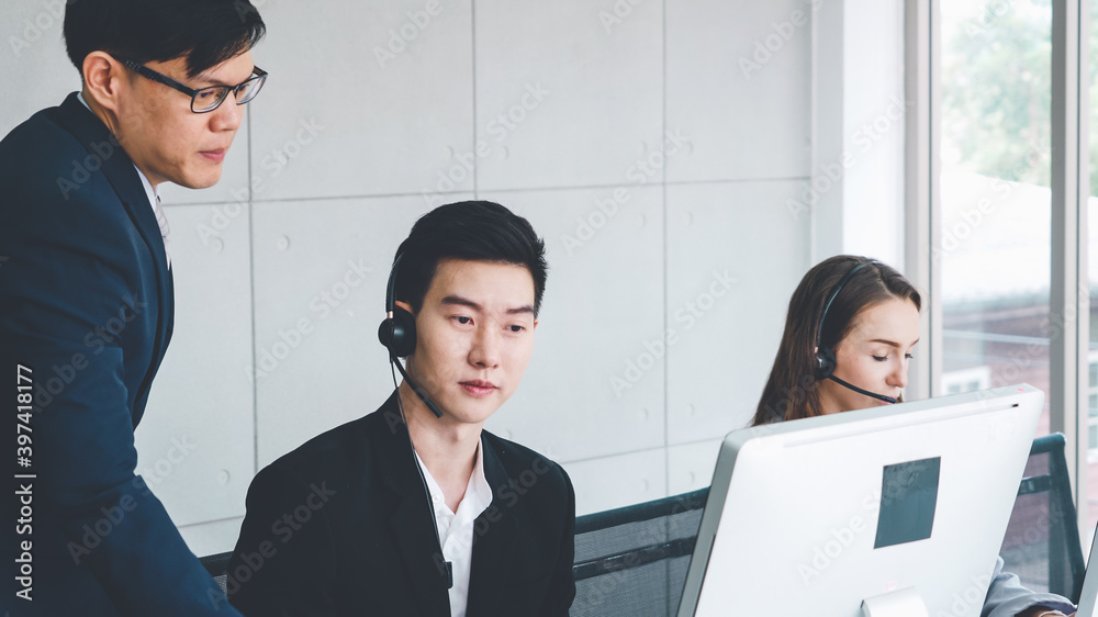 Business people wearing headset working in office to support remote customer or colleague. Call cent