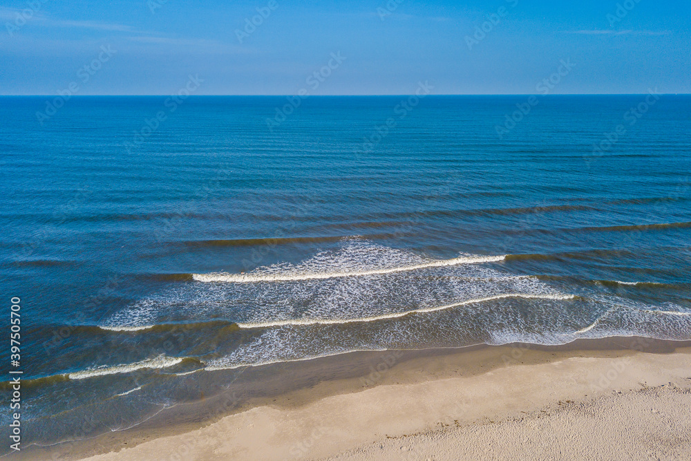 Aerial photo of surf at tropical beach