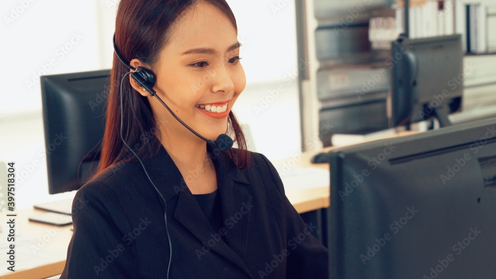 Business people wearing headset working in office to support remote customer or colleague. Call cent