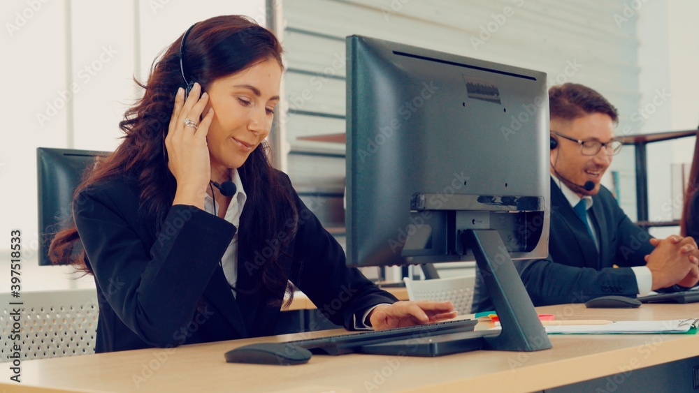 Business people wearing headset working in office to support remote customer or colleague. Call cent