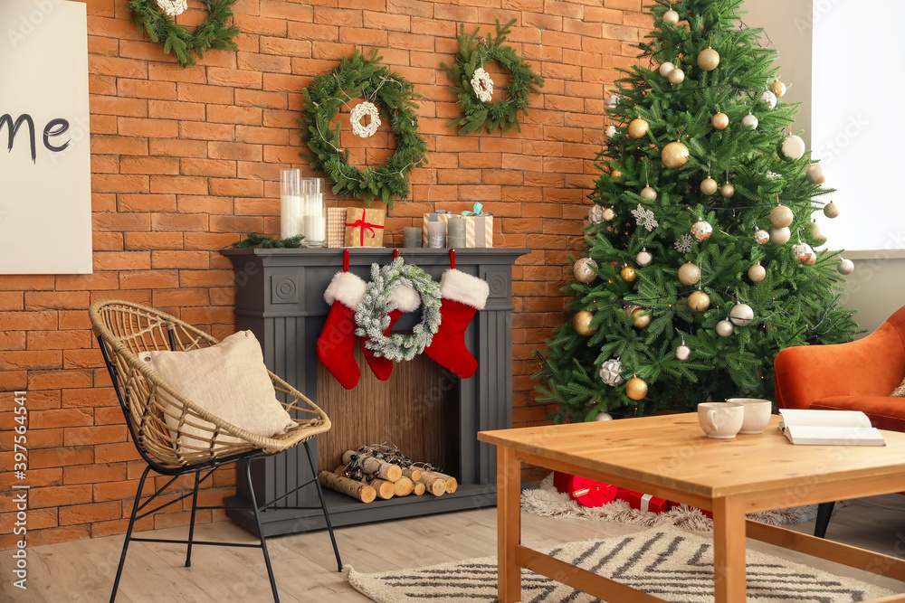 Interior of living room with fireplace decorated for Christmas