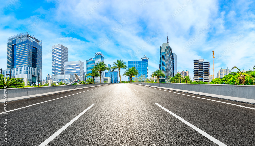 Empty asphalt road and Shanghai skyline with buildings scenery.