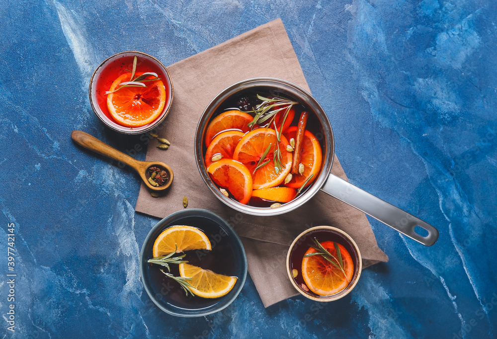 Hot mulled wine on color background