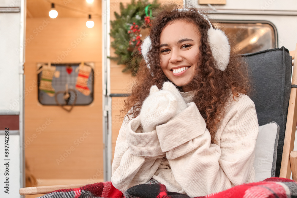 Beautiful young woman outdoors on Christmas eve