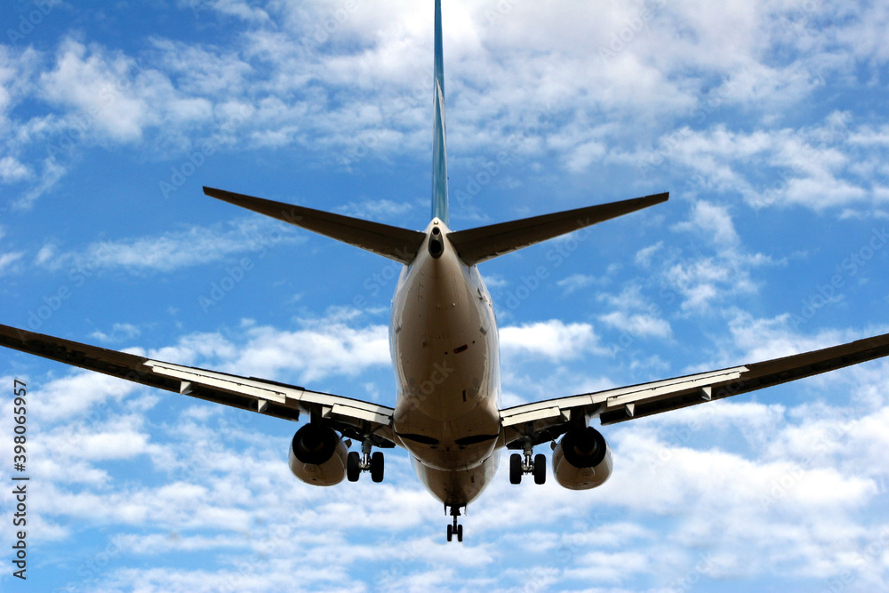 Passenger aircraft landing at close range.