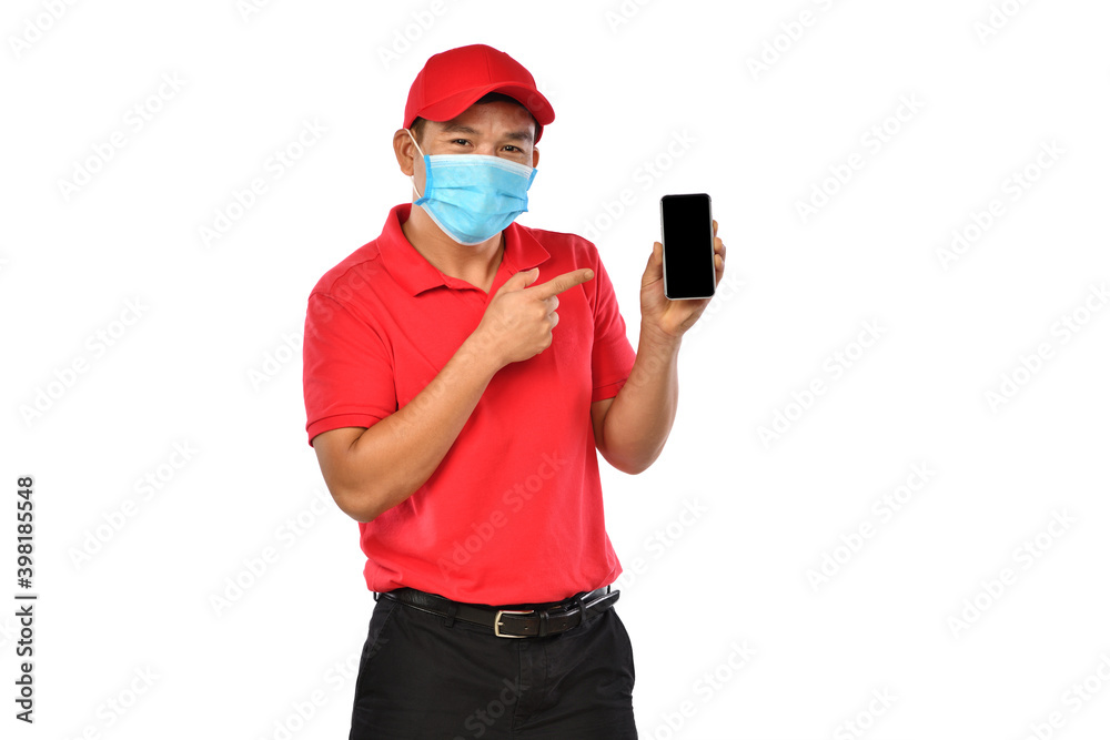 Young Asian delivery man in red uniform, medical face mask, protective gloves holding and introducin