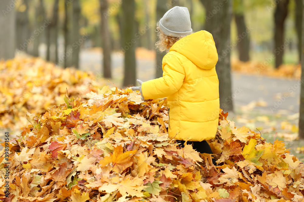 Cute little girl in autumn park