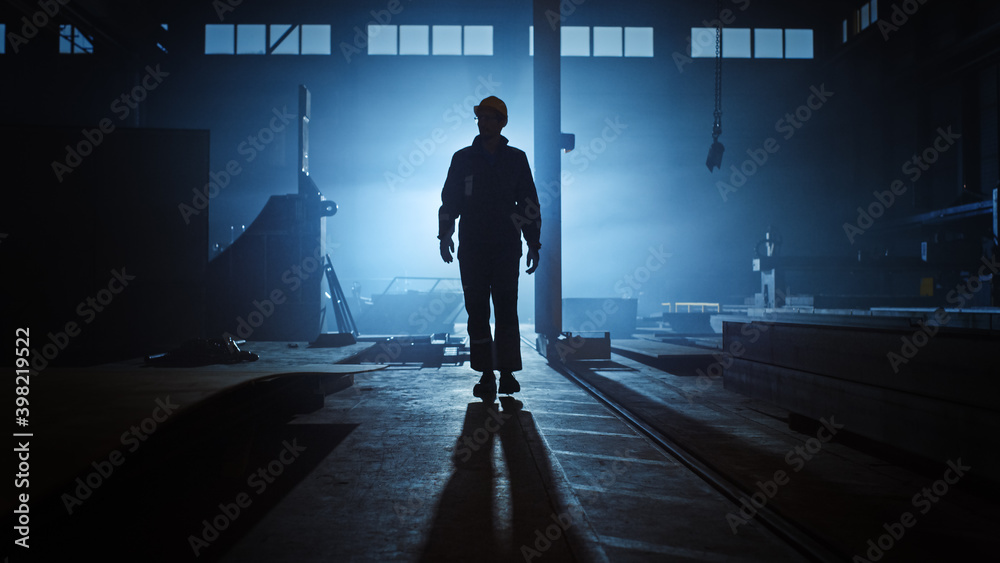 Professional Heavy Industry Engineer/Worker Wearing Uniform, Flashlight on the Hard Hat in a Steel F