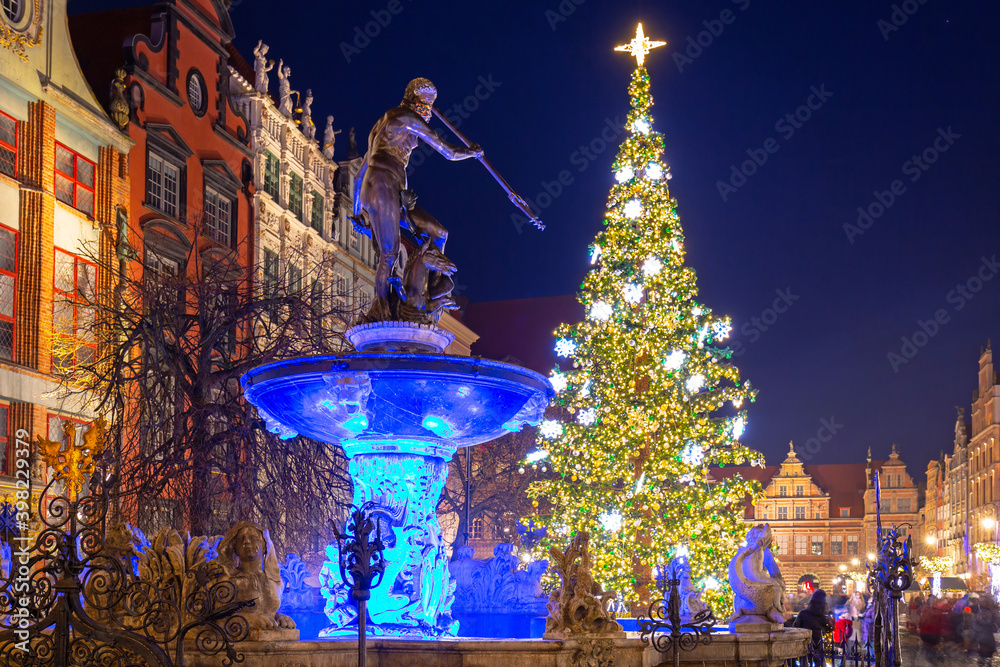 Neptune Fountain and a Christmas tree in the old town of Gdańsk. Poland