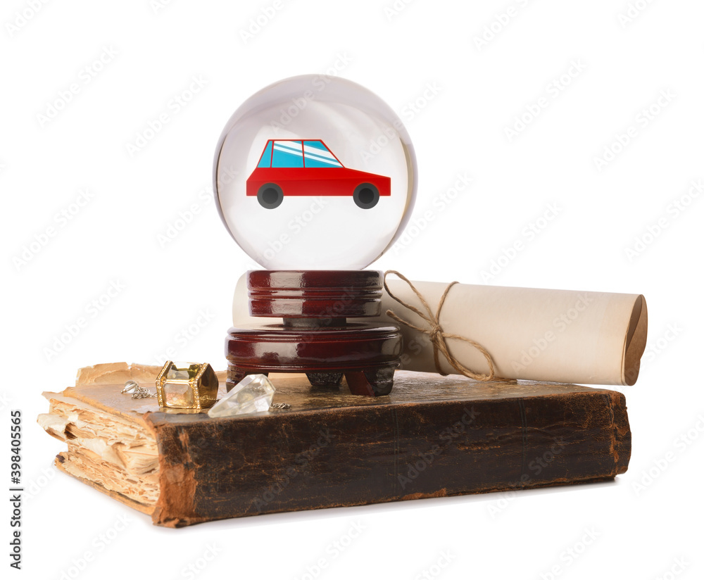 Crystal ball of fortune teller and spell book on white background. Prediction for buying of new car