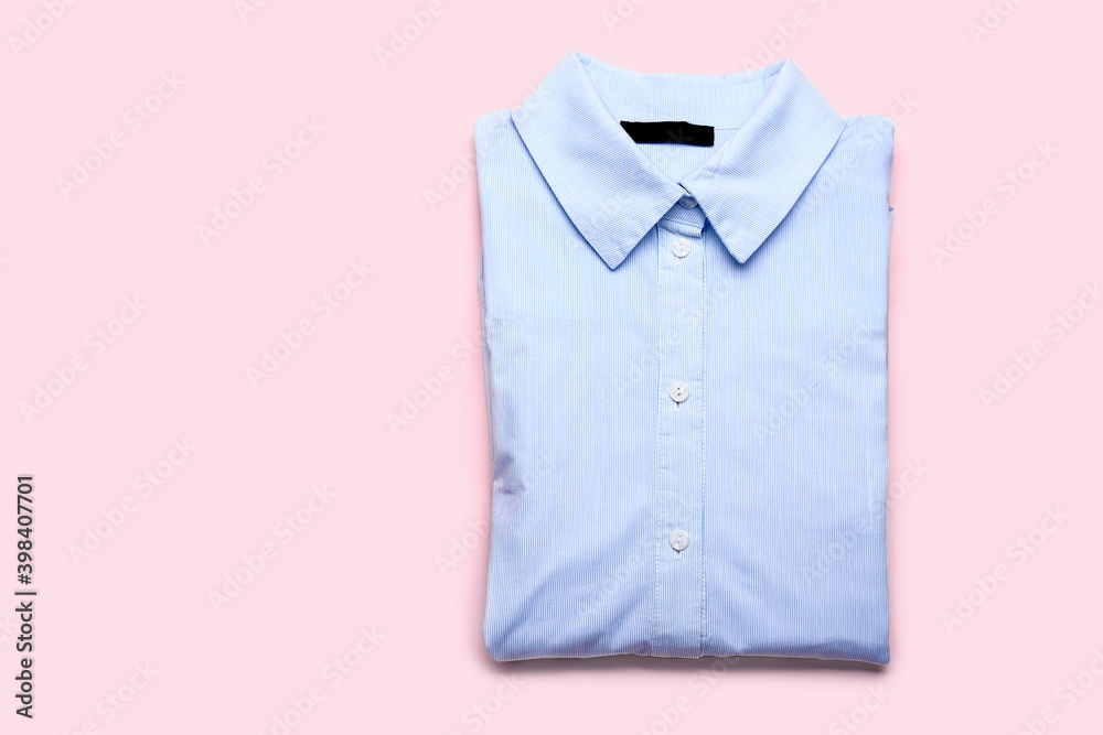 New male shirt on color background