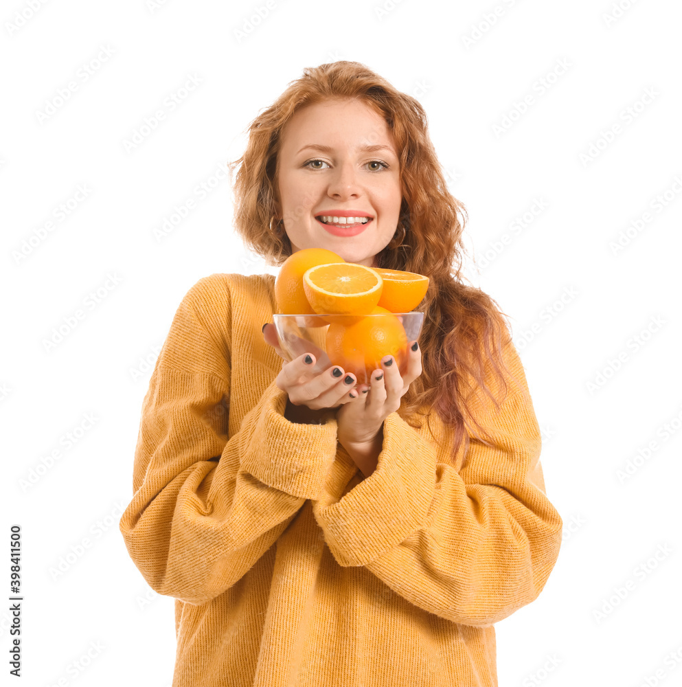 Beautiful young woman with oranges on white background