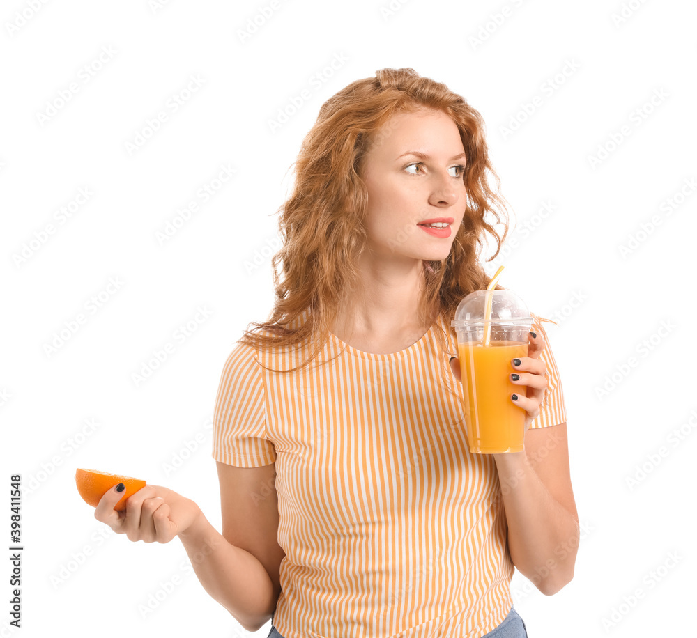 Beautiful young woman with orange juice on white background