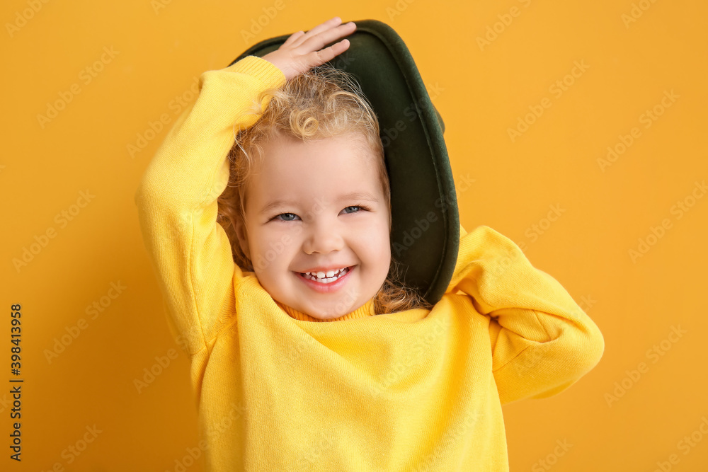 Stylish little girl on color background