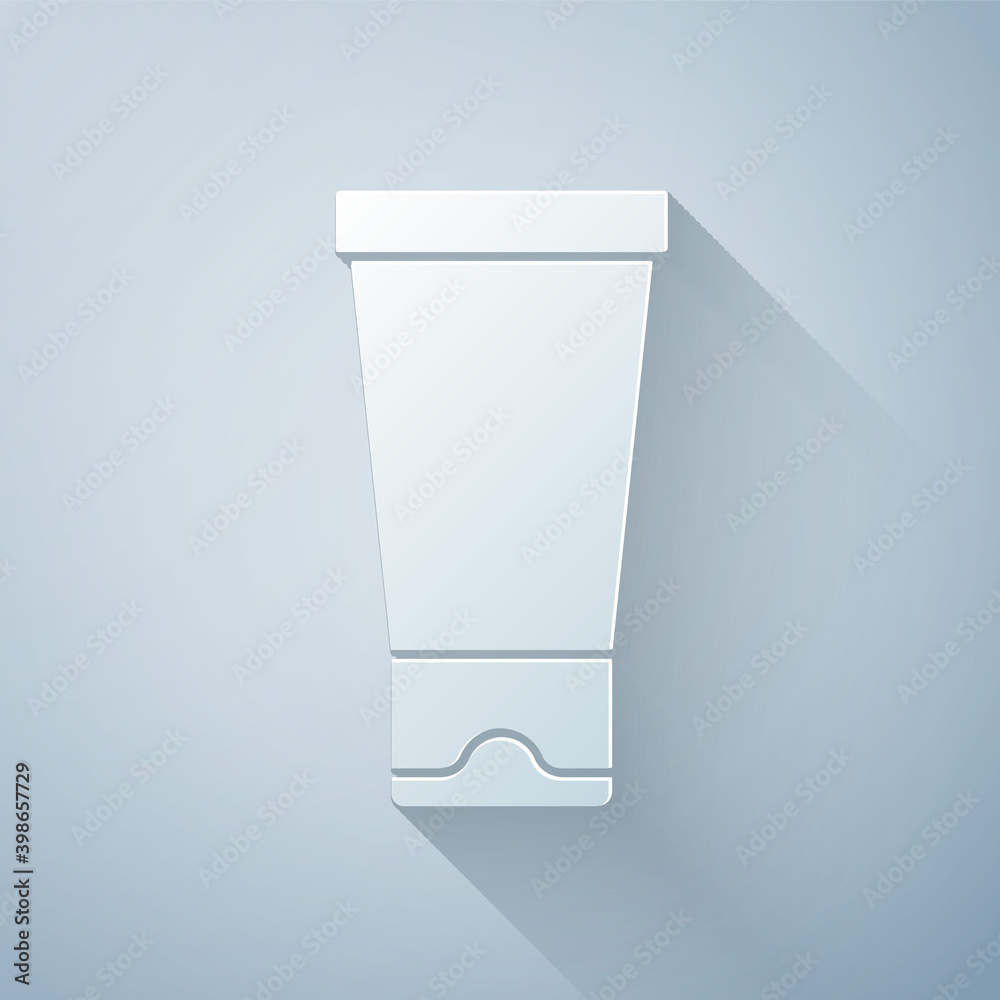 Paper cut Cream or lotion cosmetic tube icon isolated on grey background. Body care products for wom