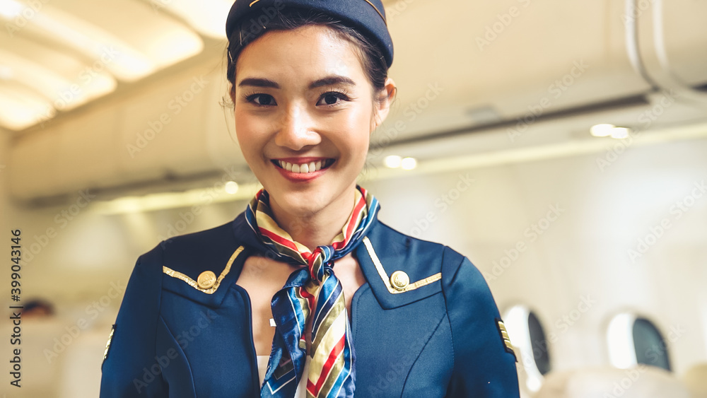 Cabin crew or air hostess working in airplane . Airline transportation and tourism concept.