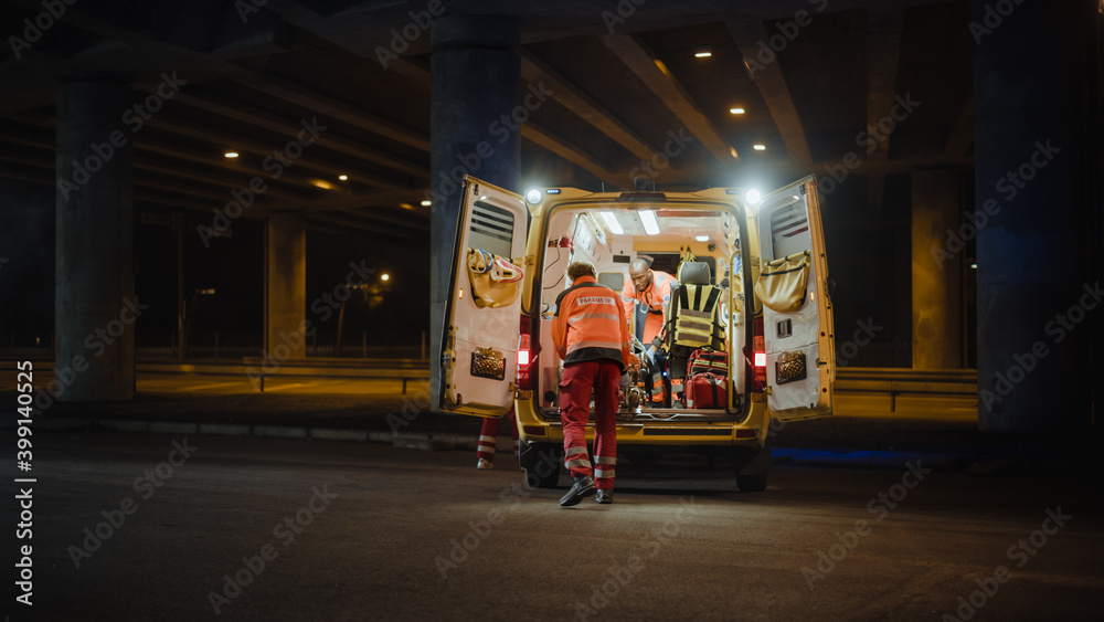 Team of EMS Paramedics React Quick to Provide Medical Help to Injured Patient and Get Him in Ambulan