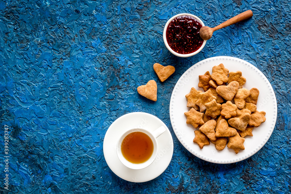 Tea with cookies and berry jam at home top view