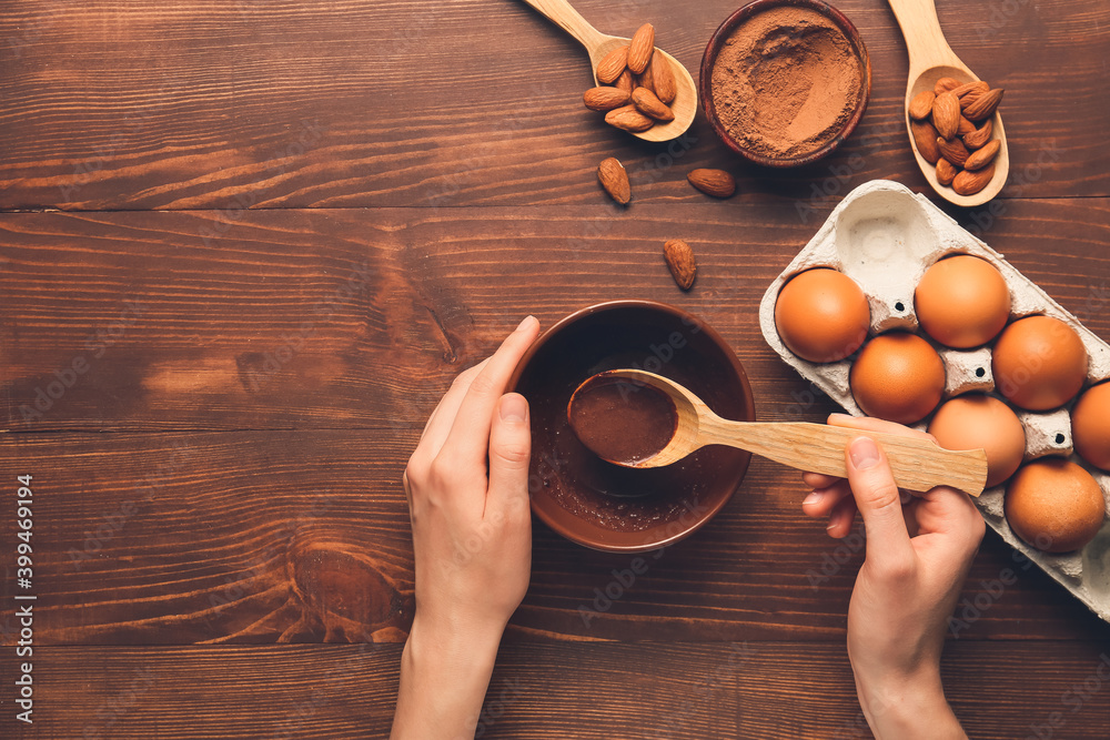 Woman preparing bakery on table, top view