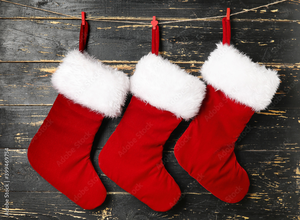 Christmas socks on dark wooden background