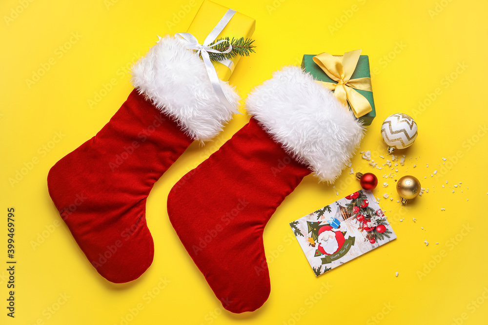 Composition with Christmas socks on color background