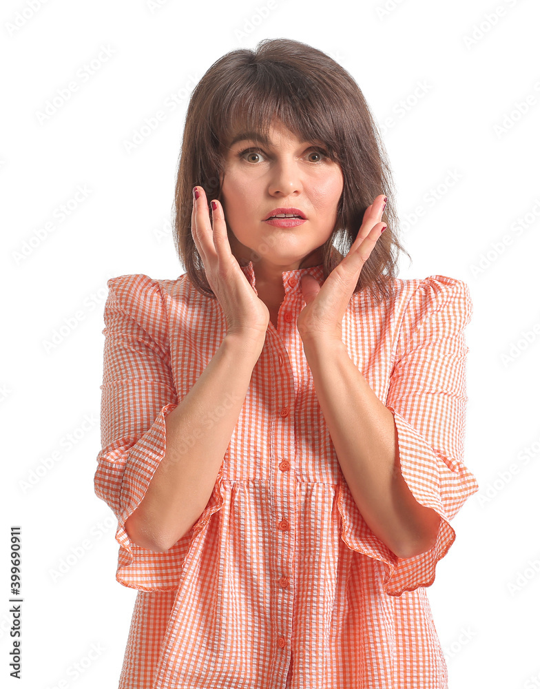 Shocked mature woman on white background