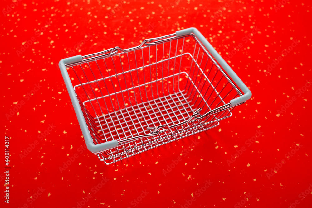 Shopping basket on golden red paper