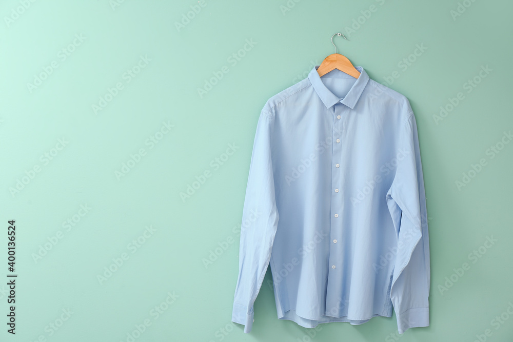 Stylish male shirt on color background