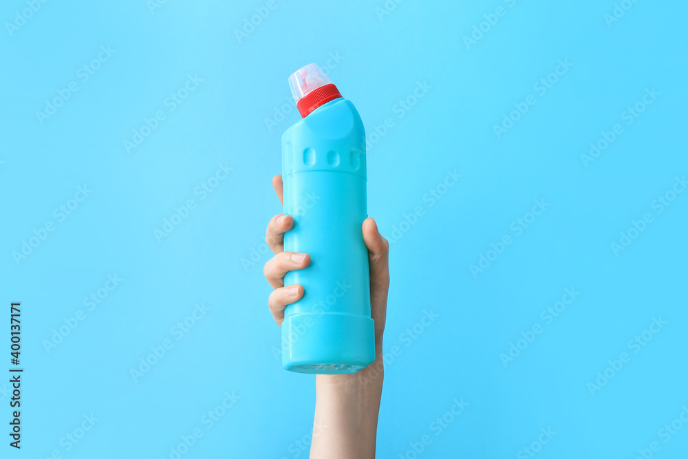 Hand with detergent on color background