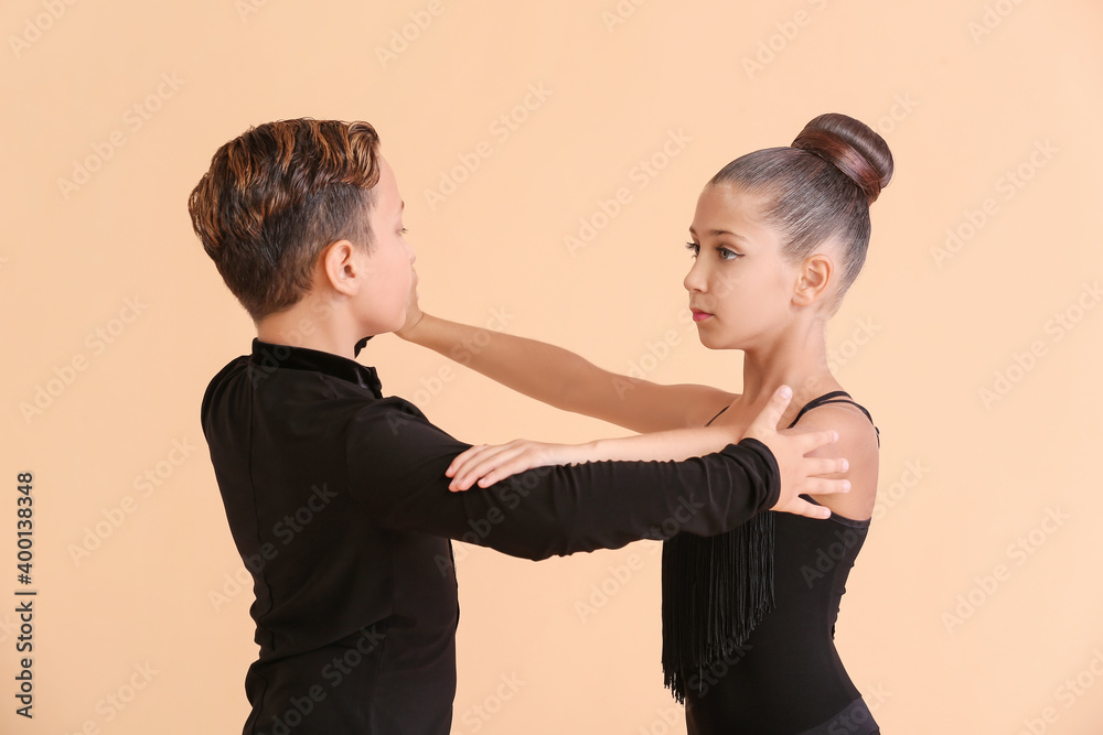 Cute little children dancing against color background