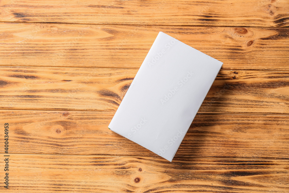 Blank book on wooden background