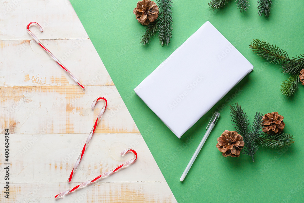 Blank book and Christmas decor on color background