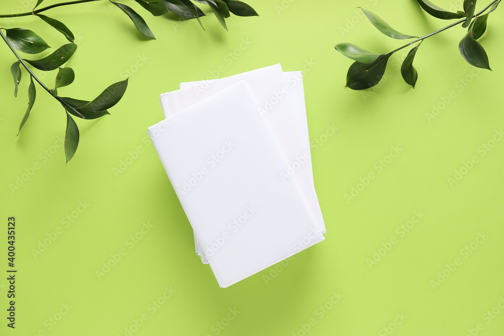 Blank books on color background