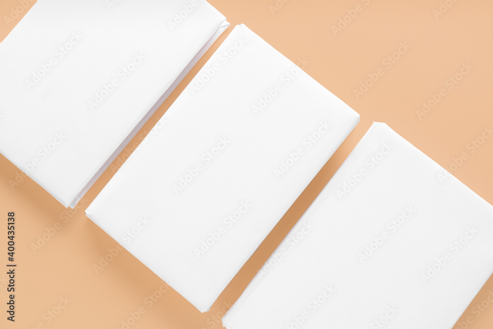 Blank books on color background