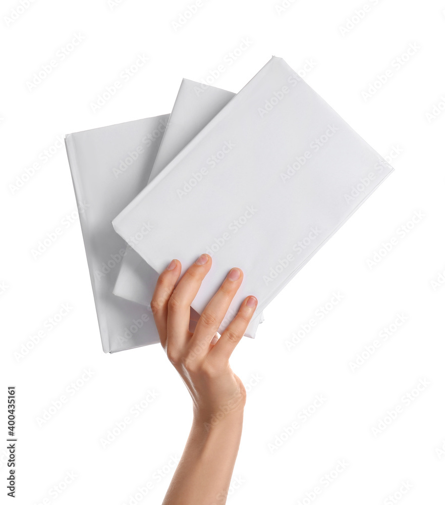 Female hand with blank books isolated on white background