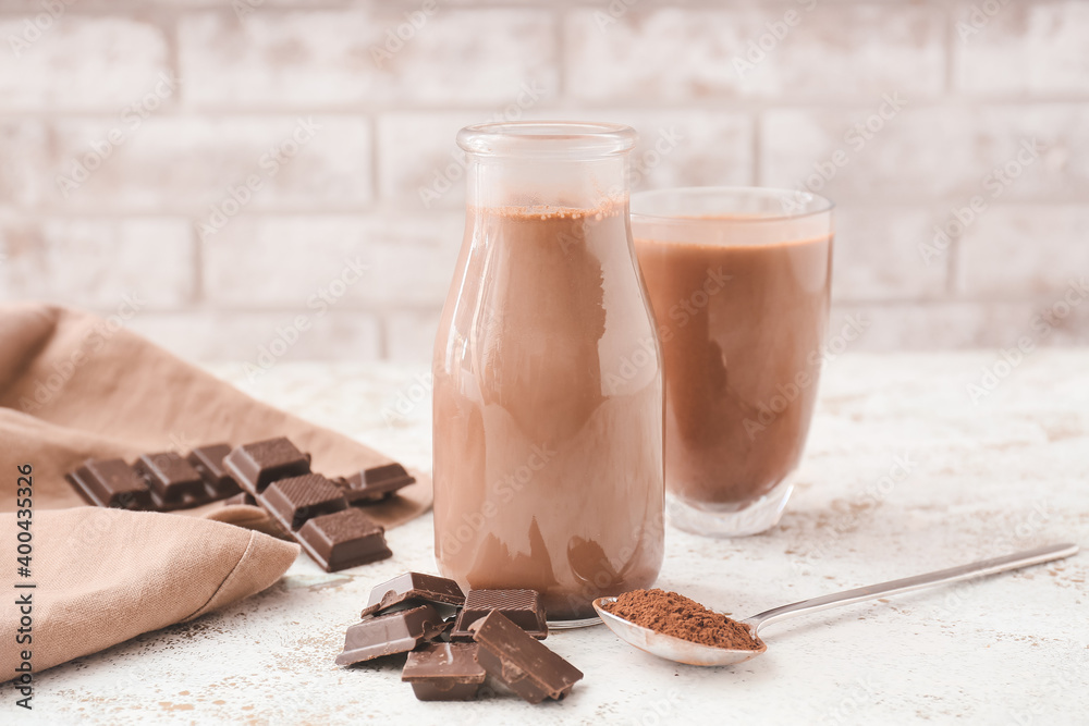 Bottle of aromatic chocolate milk on table