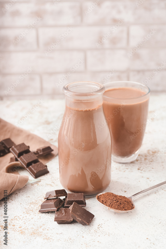 Bottle of aromatic chocolate milk on table