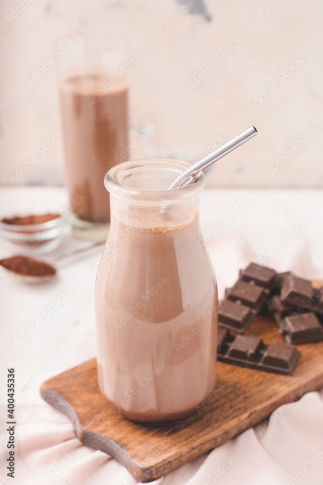 Bottle of aromatic chocolate milk on table