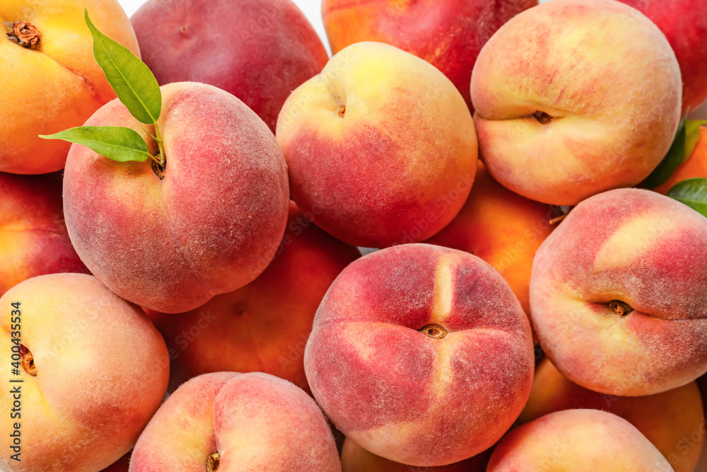 Sweet ripe peaches as background