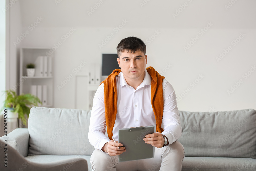 Portrait of male psychologist in office