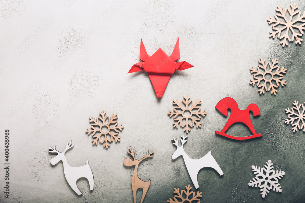 Origami bull as symbol of year 2021 and decor on light background