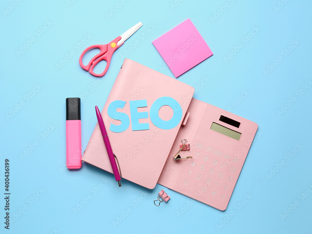 Abbreviation SEO with stationery on color background