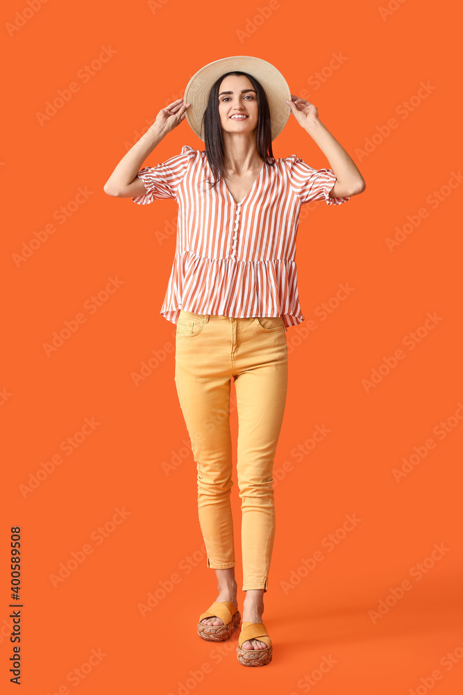 Portrait of happy young woman on color background