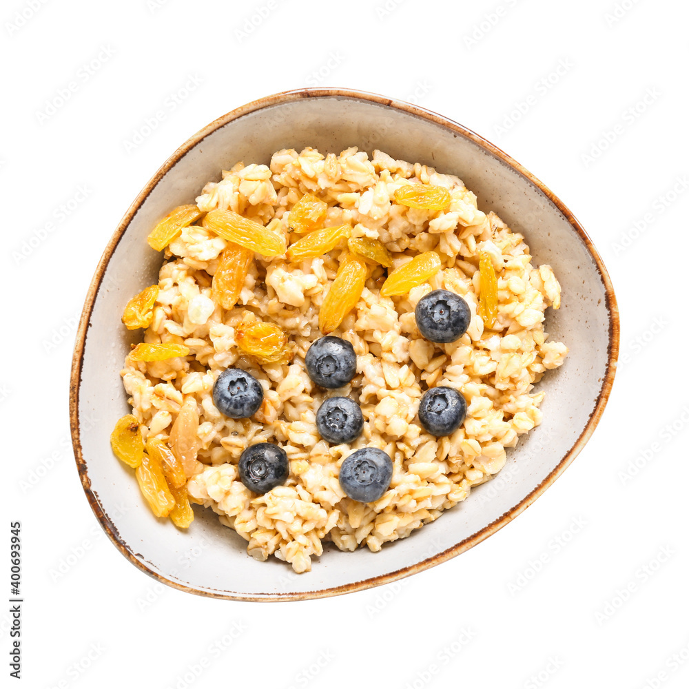 Bowl with tasty sweet oatmeal on white background