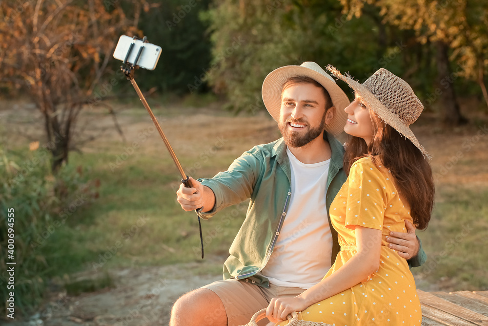 Young couple taking selfie outdoors