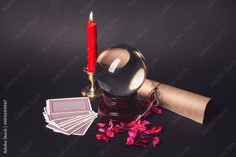 Accessories of fortune teller on dark background