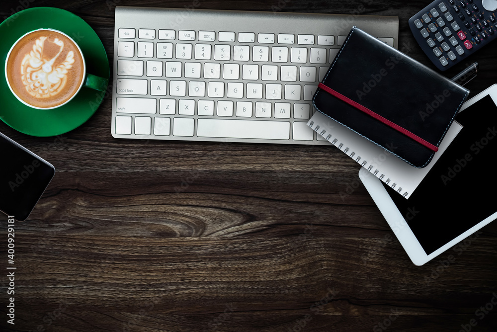 Top view of office desktop with various supplies and devices. Workplace concept.